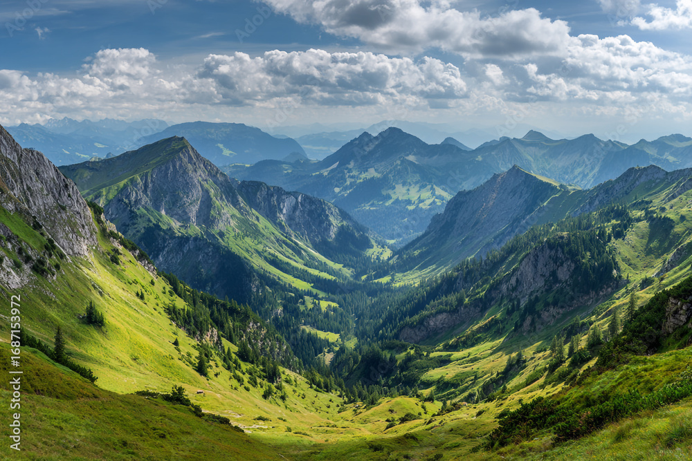 Obraz premium Majestic mountain range view green valleys and blue sky sunny day stunning landscape