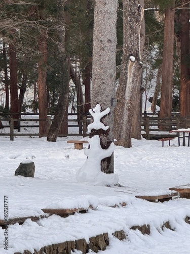 Snow Sculpture Hugging a Tree (Sapporo)