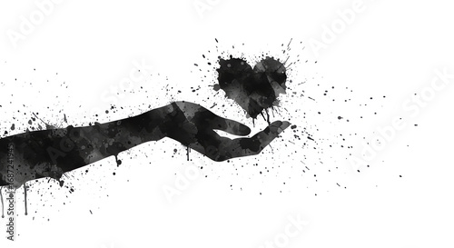Hand holding heart with ink splatter effect