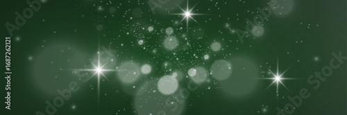 Magical glowing bokeh lights with sparkles on soft blurred background. Elegant dreamy festive atmosphere.