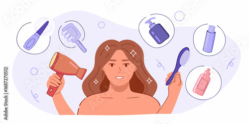 Woman with long brown hair holding a hairdryer and a comb surrounded by hair care products and tools