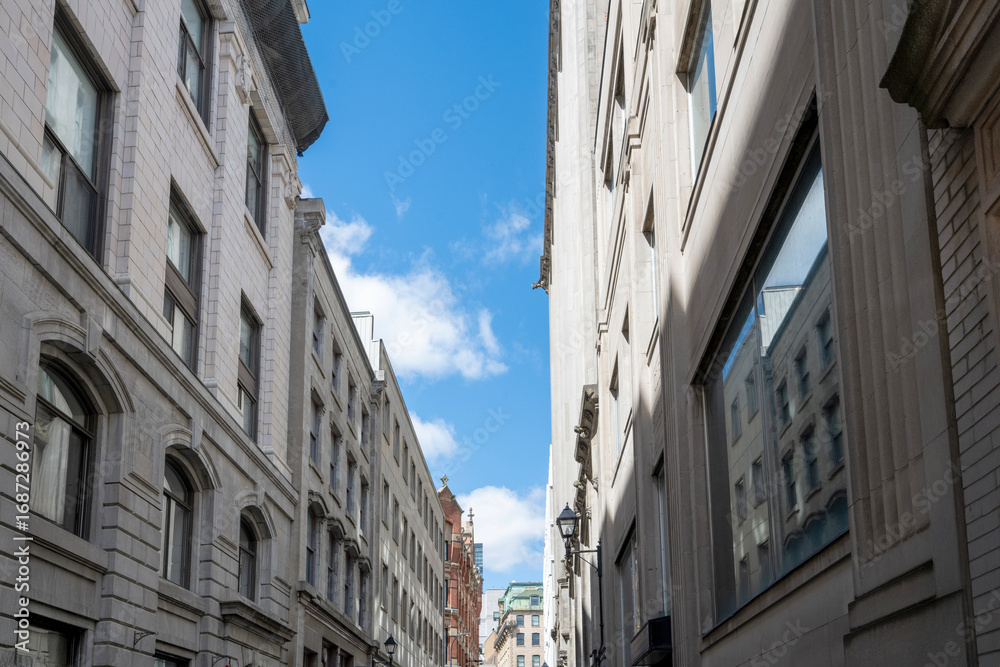 Fototapeta premium Street lined with buildings in Old Montreal