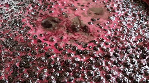 Close-up of the process of making blackcurrant jam