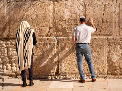 Two men pray at the Western Wall in Jerusalem