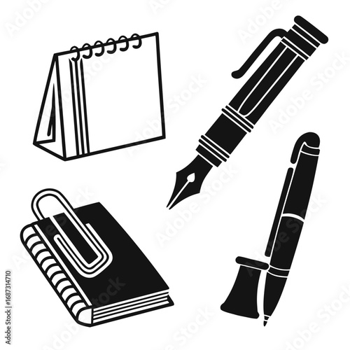 Stationery items including pens and notebook fountain pen