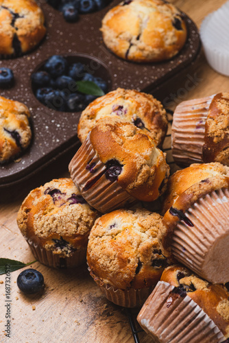 Blueberry muffins on a rustic table in a mold