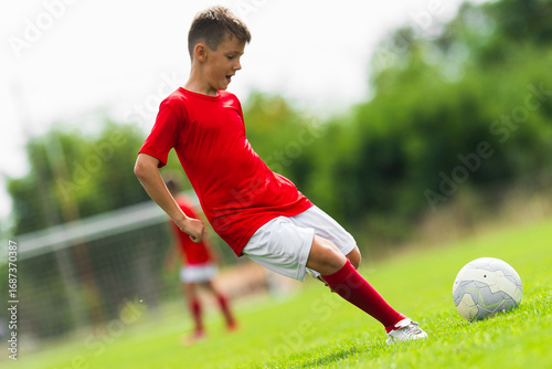 Boy Shooting at Goal