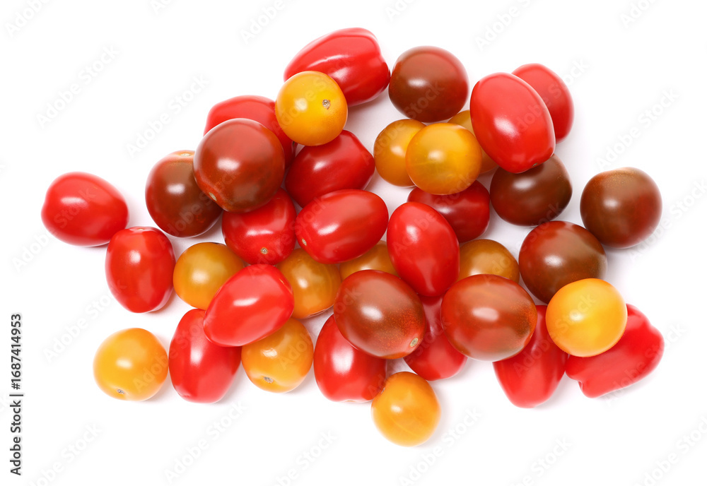 Obraz premium Heap of different ripe juicy tomatoes isolated on white, top view