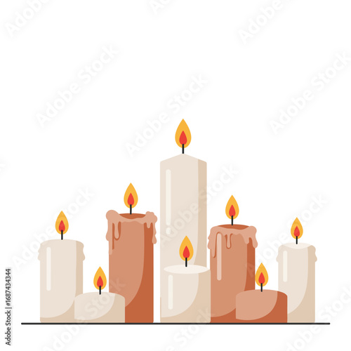 Group of burning candles in various sizes.