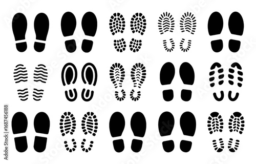 Collection of diverse black shoe and boot footprints on a white background