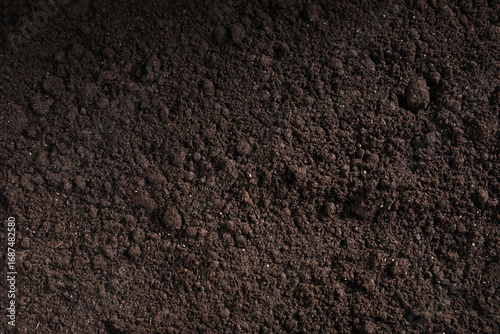 Foto Fresh soil as background, top view. Organic matter