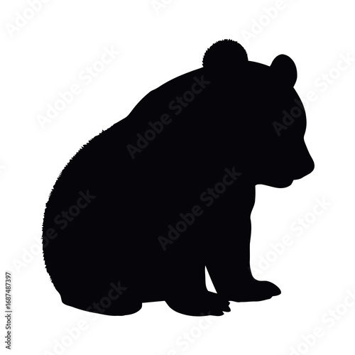 Adorable bear cub silhouette sitting patiently waiting, a symbol of strength, nature, and childhood