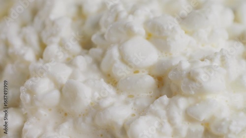 Fresh homemade cottage cheese in a bowl with a spoon, homemade dairy products. High quality 4k footage