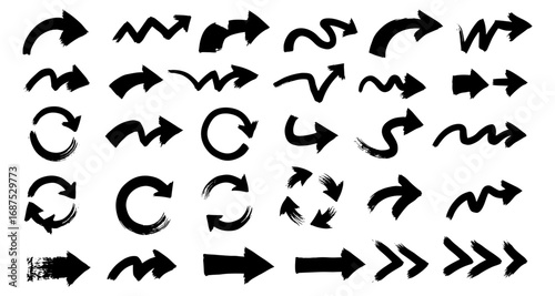 Set of hand drawn black arrow brush strokes in various directions and styles