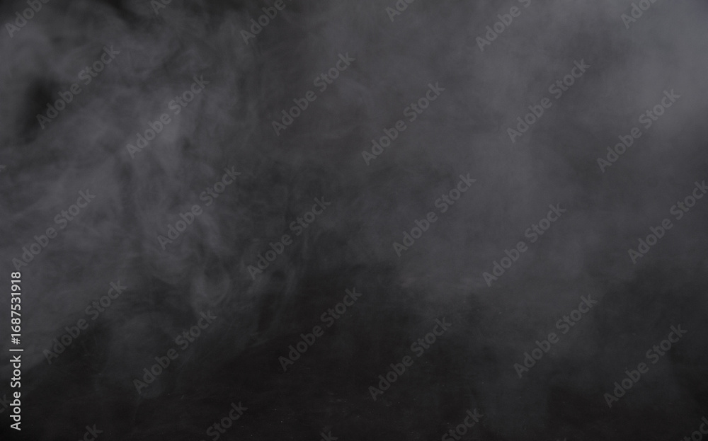 Fototapeta premium Abstract dark smoke swirls create eerie atmosphere