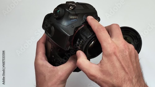 changing the lens on a camera