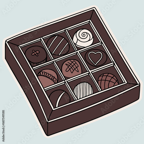 Indulge in sweet delight with a tempting assortment of gourmet chocolates arranged in a classic presentation box