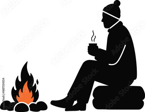 a person sitting by campfire holding mug enjoying warmth