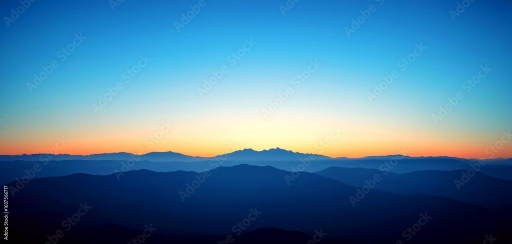 Fototapeta premium Serene mountain layers fade into soft twilight sky, inspiring peace and natural beauty.