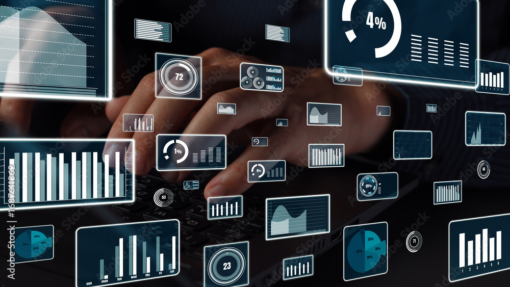 custom made wallpaper toronto digitalA close-up image of hands typing on a laptop with overlaying digital data and graphs, showcasing the modern integration of technology in business analytics and performance tracking. Xenic