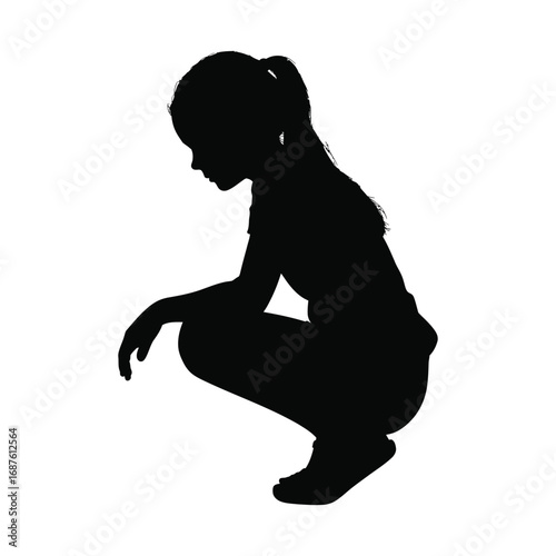 Silhouette of a Girl Squatting and Looking Down in Contemplation