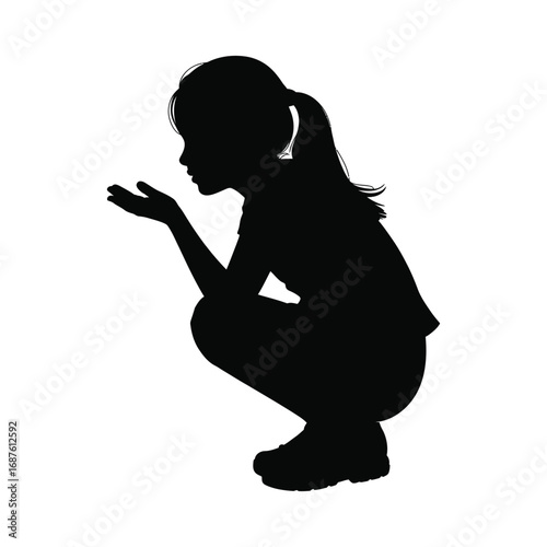 Silhouette of a Young Girl Crouching with Hands Outstretched Imagination