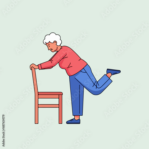 Elderly woman exercising using chair for support, active senior keeps fit. Elderly woman exercising to maintain strength and flexibility, standing exercises with chair.