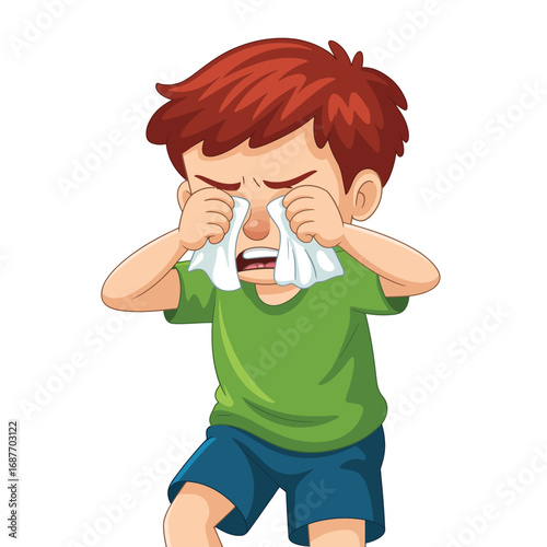 Young boy crying and wiping his eyes with a tissue