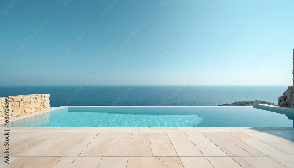 Fototapeta premium Calm ocean view from beige stone patio. Infinity pool with turquoise water under clear blue sky. Serene summer vacation scene, perfect for relaxation and travel inspiration. Minimalist elegant design.