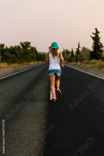 Wallpaper Mural Young sportswoman running on a countryside road during sunset Torontodigital.ca