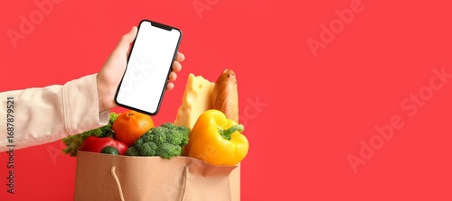 Hand holding smartphone and...