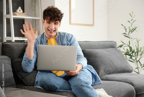 Young man video chatting wi...