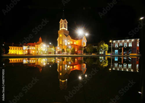 Town square reflection of Zrenjanin at night.