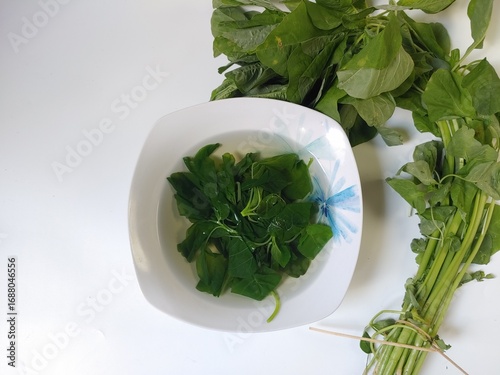 Sayur Bening Bayam or Spinach Clear Soup, isolated on white background 