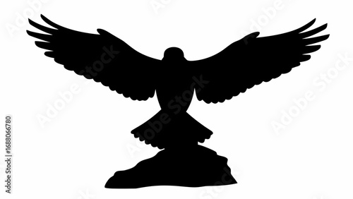 Silhouette of an eagle with its wings spread wide perched atop a rocky formation against a white background