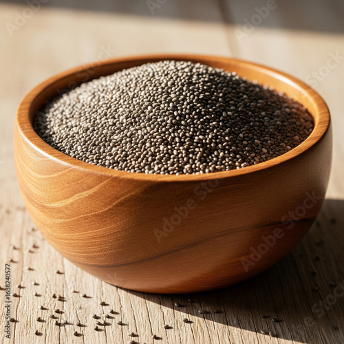 A rustic wooden bowl filled with healthy chia seeds, a nutritious superfood
