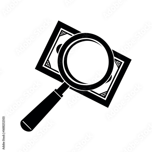 Magnifying glass over dollar bill, searching for financial details, auditing concept