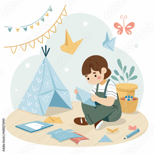 Creative child focused on making paper art.