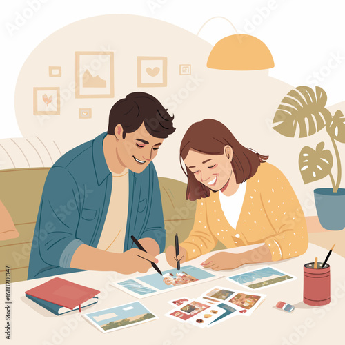 Happy young couple creating a photo album together at home.