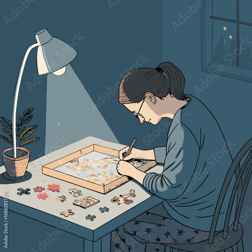 Woman assembling a jigsaw puzzle under a desk lamp at night.