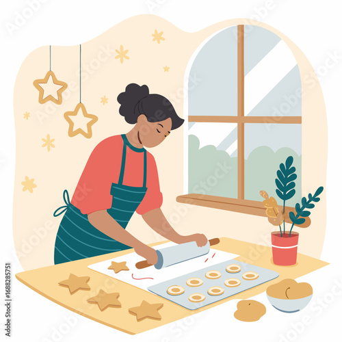 Young woman in an apron baking festive star shaped cookies in the kitchen.