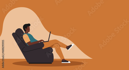 Young man comfortably works from home on his laptop, embodying remote work, online learning, or digital leisure in a cozy, modern setting.