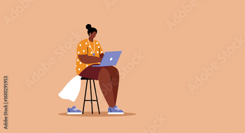 A woman in a polka-dot shirt works diligently on her laptop while sitting on a stool, representing remote work, online learning, or digital entrepreneurship.