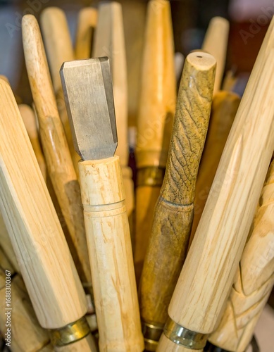 Collection of Wooden Carving Tools in Artisan Workshop
