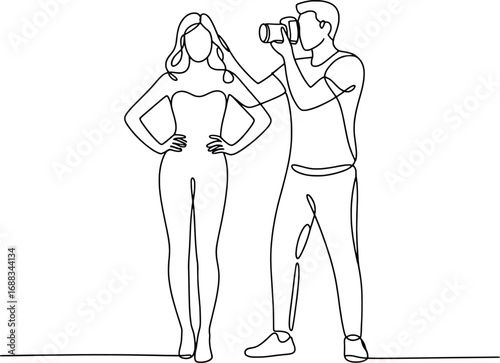 Fashion photographer capturing a model's pose for a professional photoshoot artistic creation