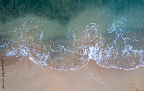 Drone aerial with sea beach with turquoise water and copy space for text. Beautiful seascape of sandy beach