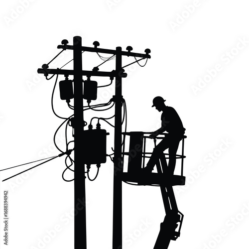 Electrician silhouette working on power lines in bucket truck