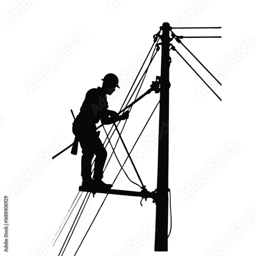 Silhouette of lineman working on utility pole with wires