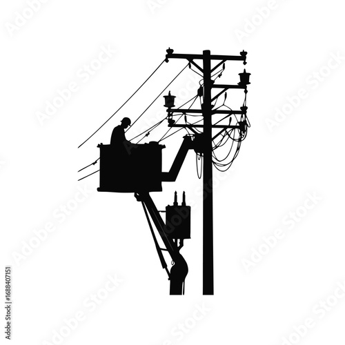Silhouette of lineman working on power pole in bucket truck