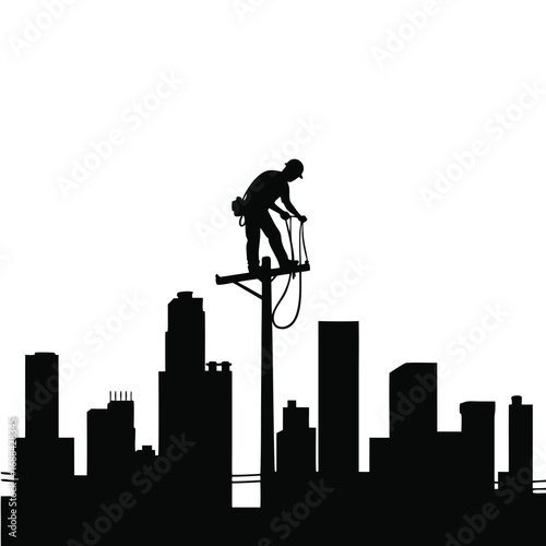 Lineman silhouette working on utility pole over city skyline